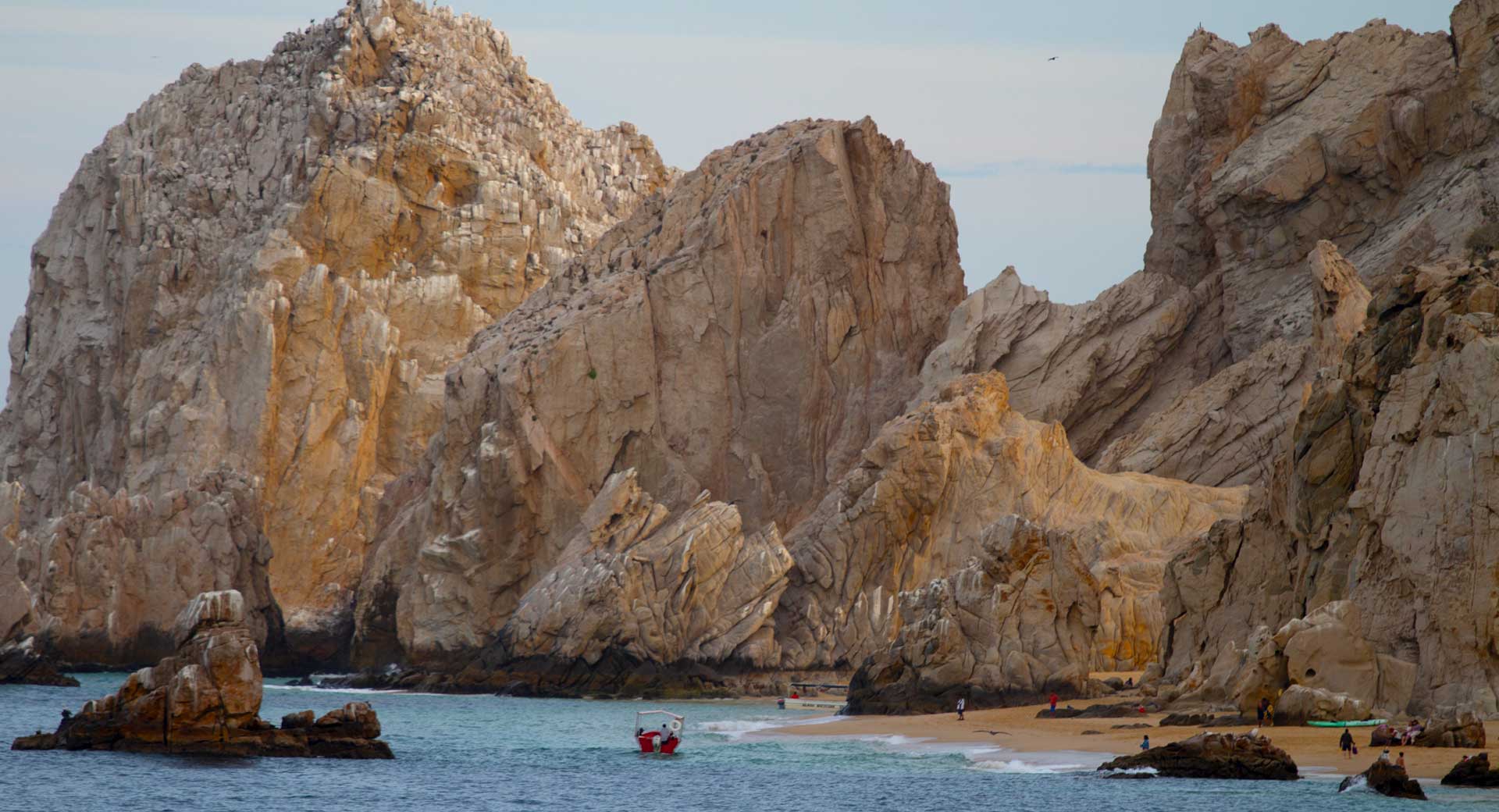 Parasailing along the rugged cliffs in Cabo